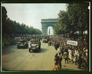 Crowds of French patriots line the Champs Elysees to view Allied tanks and half tracks pass through the Arc du Triomphe, after Paris was liberated on August 25, 1944  (LOC)