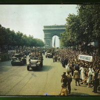 Crowds of French patriots line the Champs Elysees to view Allied tanks and half tracks pass through the Arc du Triomphe, after Paris was liberated on August 25, 1944  (LOC)